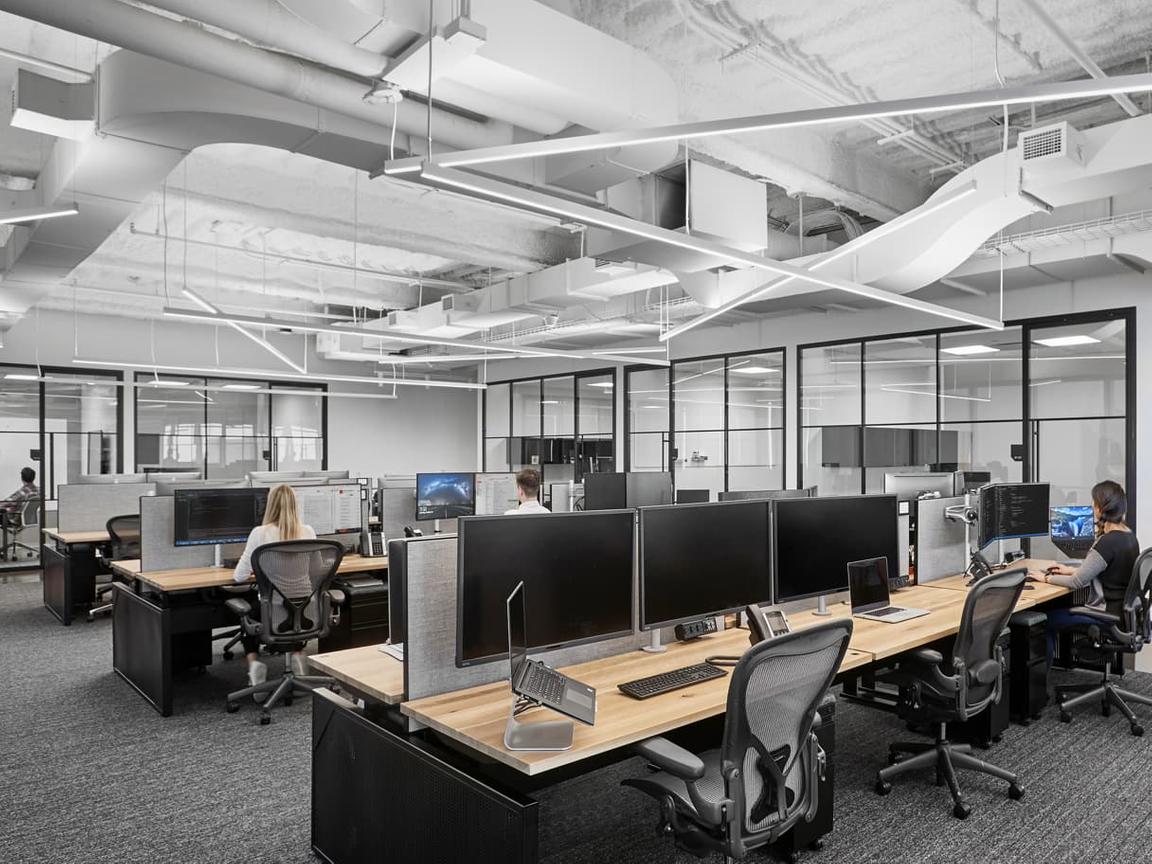 linear pendants over open desk area