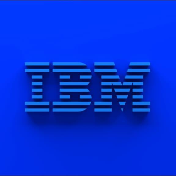 IBM 8-bar logo in blue on blue wall